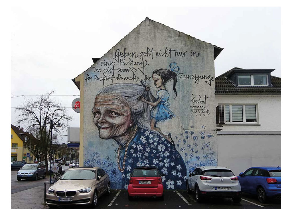 Geben geht nicht nur in eine Richtung - Mural von Herakut in Bad Vilbel