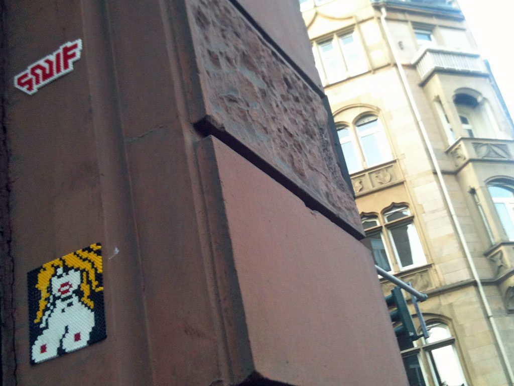 Topless Woman as Perler Beads Streetart in Frankfurt