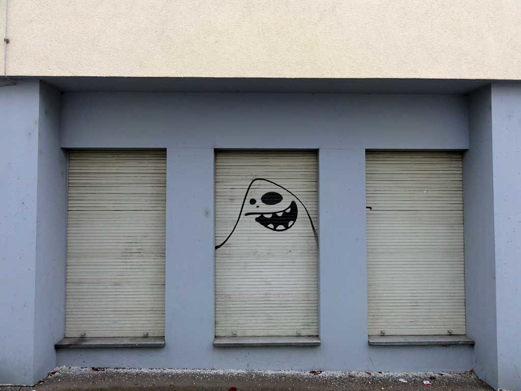 Cityghost von Spot an einem Fensterrollladen
